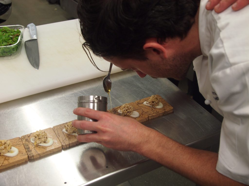 Tom Gore working in the kitchen