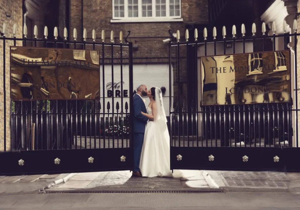 Wedding at The Brewery couple by the gate 