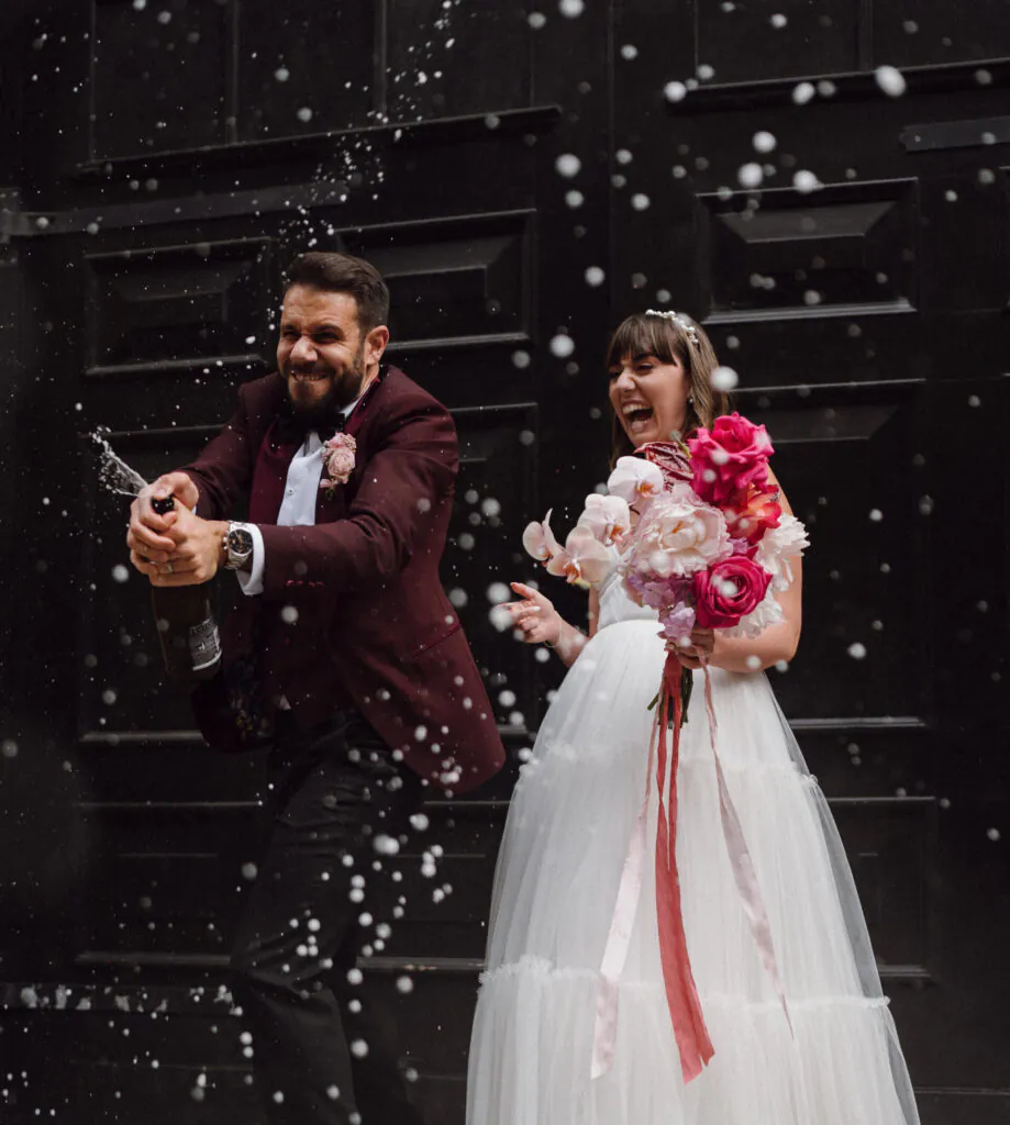 Holly & Demetri's WEdding - Champagne Spray in the Courtyard